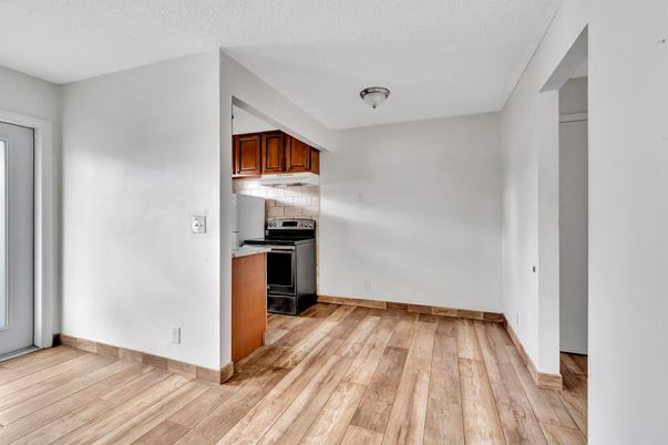 Empty room, Interior, Kitchen, Stainless Steel Appliances, Wood Texture Flooring