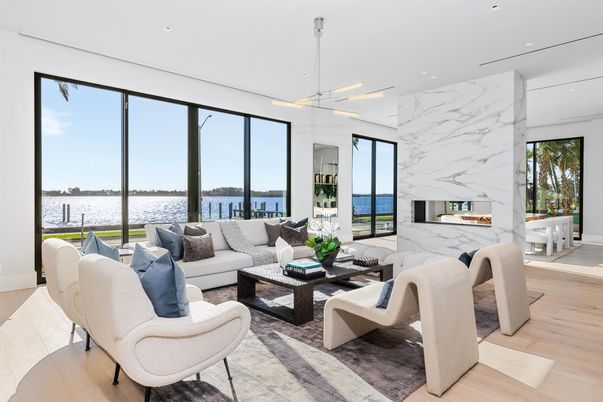 Fireplace, Interior, Living room, Marble Walls, Pendant Lights, Recessed Lighting, Water, Wood Texture Flooring