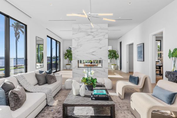 Fireplace, Interior, Living room, Marble Walls, Recessed Lighting, Water, Wood Texture Flooring