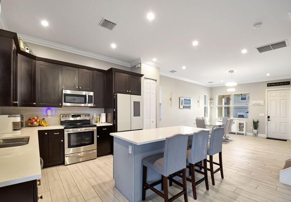 Dining room, Interior, Kitchen, Pendant Lights, Recessed Lighting, Stainless Steel Appliances, Wood Texture Flooring