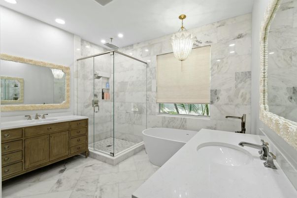 Bathroom, Chandelier, Dual Sink Vanities, Free Standing Baths, Glass Shower, Interior, Marble, Marble Walls, Recessed Lighting
