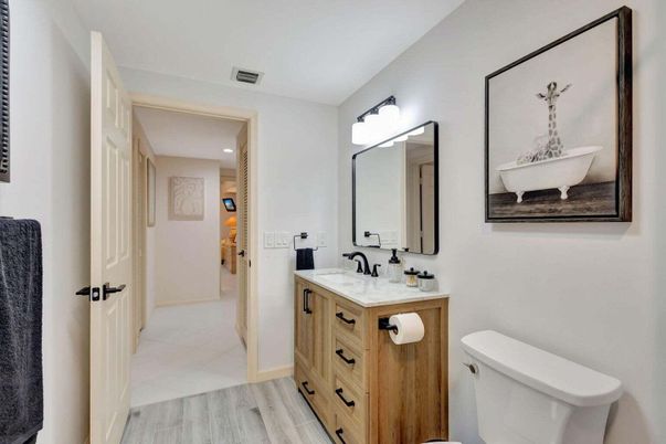 Bathroom, Dual Sink Vanities, Interior, Recessed Lighting, Wood Texture Flooring