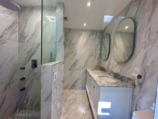 Bathroom, Dual Sink Vanities, Glass Shower, Interior, Marble, Marble Walls, Recessed Lighting