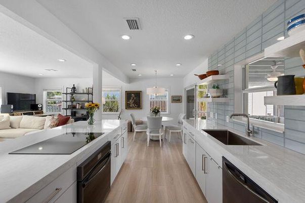 Chandelier, Dining room, Interior, Kitchen, Living room, Pendant Lights, Recessed Lighting, Stainless Steel Appliances, Wood Texture Flooring