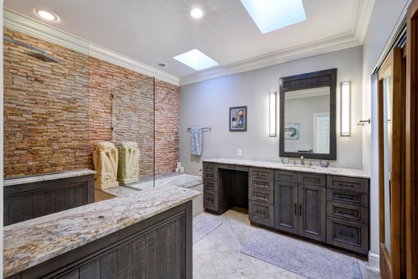 Bathroom, Dual Sink Vanities, Glass Shower, Interior, Recessed Lighting, Stone Walls