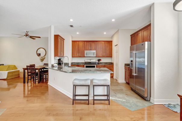 Dining room, Interior, Kitchen, Recessed Lighting, Stainless Steel Appliances, Wood Texture Flooring