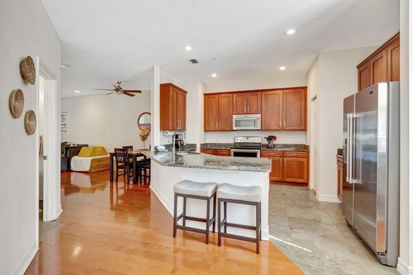 Dining room, Interior, Kitchen, Recessed Lighting, Stainless Steel Appliances, Wood Texture Flooring