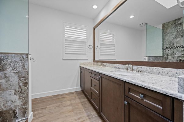 Bathroom, Dual Sink Vanities, Interior, Recessed Lighting, Wood Texture Flooring