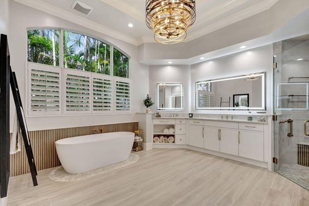 Bathroom, Chandelier, Dual Sink Vanities, Free Standing Baths, Glass Shower, Interior, Pendant Lights, Recessed Lighting, Wood Texture Flooring