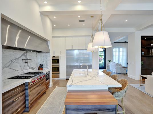 Interior, Kitchen, Marble Walls, Pendant Lights, Recessed Lighting, Stainless Steel Appliances, Wood Texture Flooring