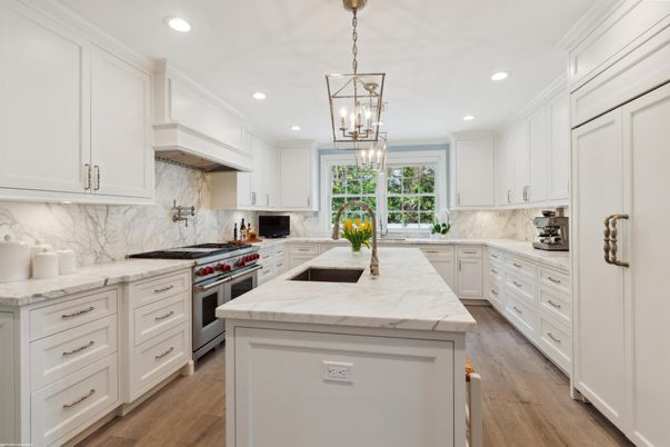 Interior, Kitchen, Marble Walls, Pendant Lights, Recessed Lighting, Stainless Steel Appliances, Wood Texture Flooring