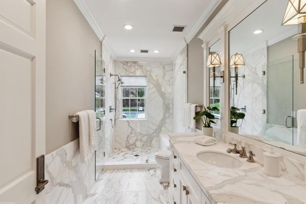 Bathroom, Dual Sink Vanities, Glass Shower, Interior, Marble, Marble Walls, Recessed Lighting