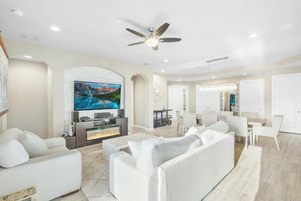 Chandelier, Dining room, Fireplace, Interior, Living room, Pendant Lights, Recessed Lighting, Wood Texture Flooring