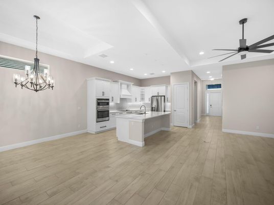 Chandelier, Empty room, Interior, Kitchen, Pendant Lights, Recessed Lighting, Stainless Steel Appliances, Wood Texture Flooring