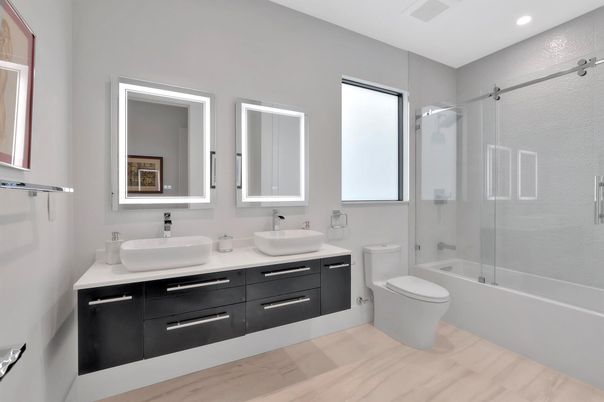 Bathroom, Dual Sink Vanities, Glass Shower, Interior, Marble, Recessed Lighting, Wood Texture Flooring