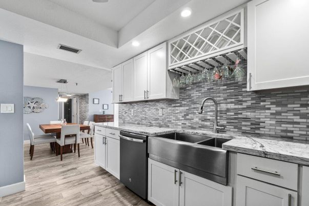 Dining room, Interior, Kitchen, Pendant Lights, Recessed Lighting, Stainless Steel Appliances, Stone Walls, Wood Texture Flooring