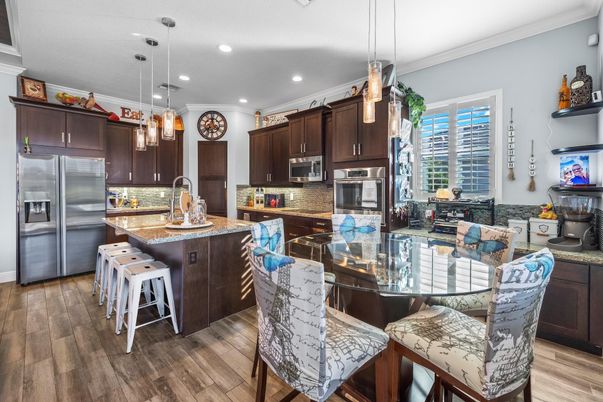 Dining room, Interior, Kitchen, Pendant Lights, Recessed Lighting, Stainless Steel Appliances, Wood Texture Flooring