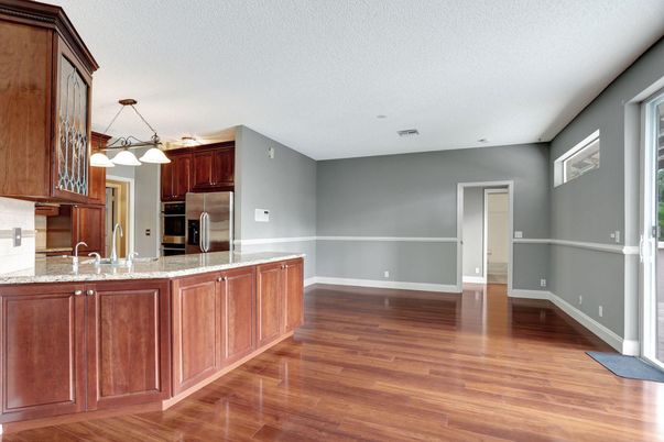 Empty room, Interior, Kitchen, Pendant Lights, Stainless Steel Appliances, Wood Texture Flooring