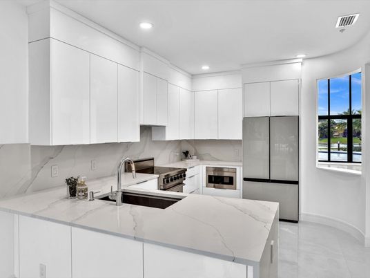 Interior, Kitchen, Marble Walls, Recessed Lighting, Stainless Steel Appliances