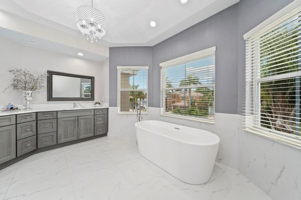 Bathroom, Chandelier, Dual Sink Vanities, Free Standing Baths, Interior, Marble, Marble Walls, Pendant Lights, Recessed Lighting