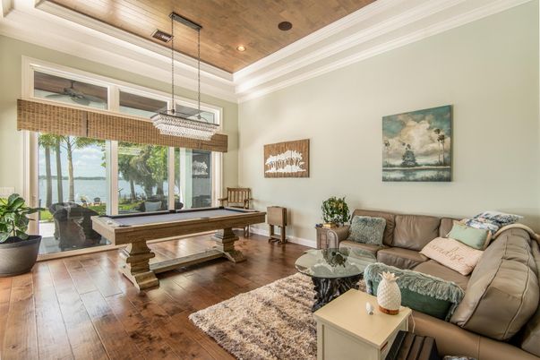 Billiard Table, Chandelier, Game Room, Interior, Living room, Pendant Lights, Recessed Lighting, Water, Wooden Ceilings, Wood Texture Flooring