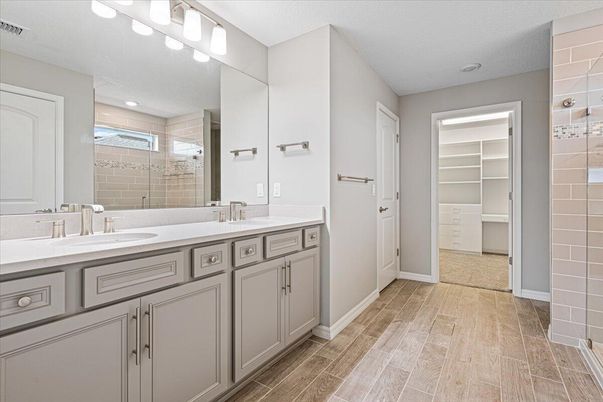 Bathroom, Dual Sink Vanities, Glass Shower, Interior, Recessed Lighting, Wood Texture Flooring
