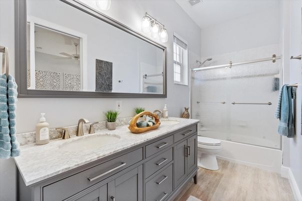Bathroom, Dual Sink Vanities, Glass Shower, Interior, Wood Texture Flooring