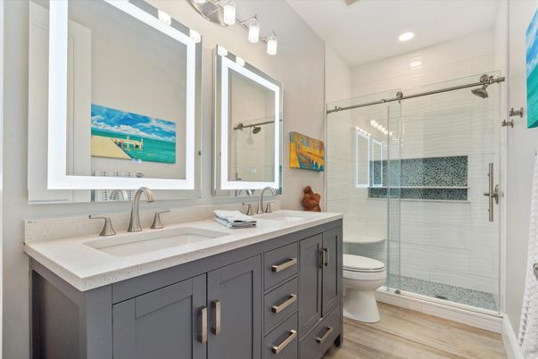 Bathroom, Dual Sink Vanities, Glass Shower, Interior, Recessed Lighting, Wood Texture Flooring