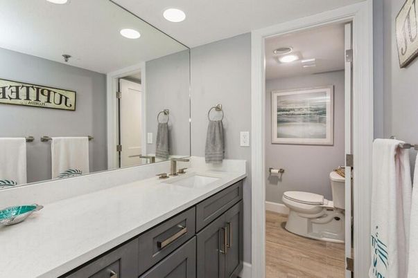 Bathroom, Dual Sink Vanities, Interior, Recessed Lighting, Wood Texture Flooring