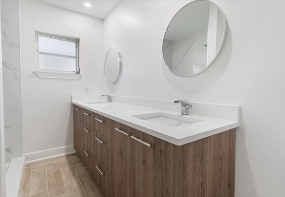 Bathroom, Dual Sink Vanities, Interior, Marble Walls, Recessed Lighting, Wood Texture Flooring