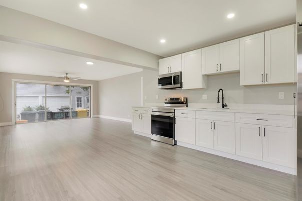 Dining room, Interior, Kitchen, Recessed Lighting, Stainless Steel Appliances, Wood Texture Flooring