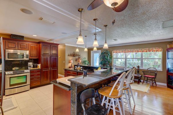 Dining room, Interior, Kitchen, Pendant Lights, Recessed Lighting, Stainless Steel Appliances, Wood Texture Flooring