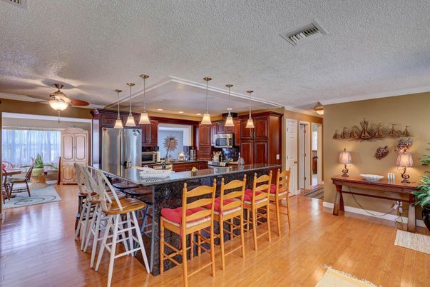 Dining room, Interior, Kitchen, Pendant Lights, Recessed Lighting, Stainless Steel Appliances, Wood Texture Flooring