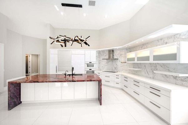 Interior, Kitchen, Marble Walls, Pendant Lights, Recessed Lighting, Stainless Steel Appliances