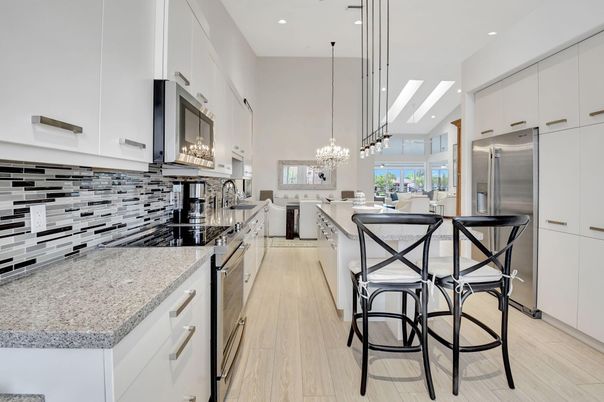 Chandelier, Dining room, Interior, Kitchen, Pendant Lights, Recessed Lighting, Stainless Steel Appliances, Wood Texture Flooring