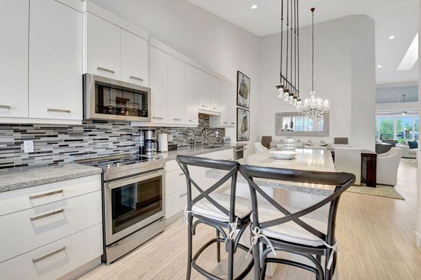 Chandelier, Dining room, Interior, Kitchen, Pendant Lights, Recessed Lighting, Stainless Steel Appliances, Wood Texture Flooring
