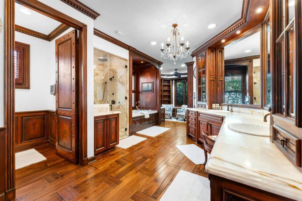 Bathroom, Chandelier, Dual Sink Vanities, Glass Shower, Interior, Recessed Lighting, Wood Texture Flooring