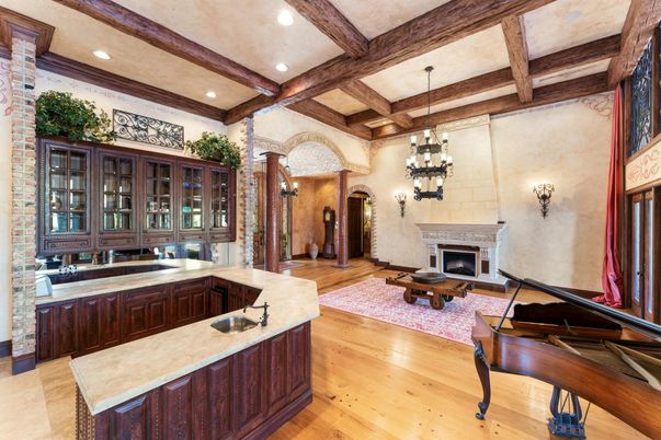 Chandelier, Fireplace, Interior, Piano, Recessed Lighting, Stone Walls, Wooden Beams, Wood Texture Flooring
