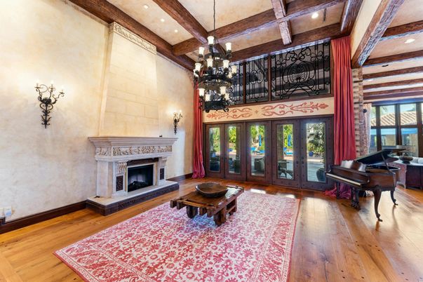 Chandelier, Fireplace, Interior, Living room, Piano, Recessed Lighting, Wooden Beams, Wood Texture Flooring
