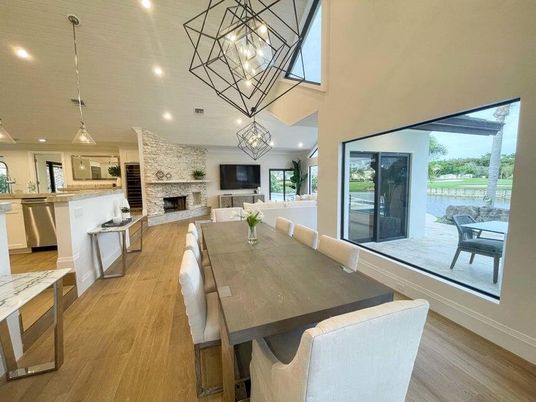 Dining room, Fireplace, Interior, Kitchen, Living room, Pendant Lights, Recessed Lighting, Stainless Steel Appliances, Stone Walls, Wood Texture Flooring