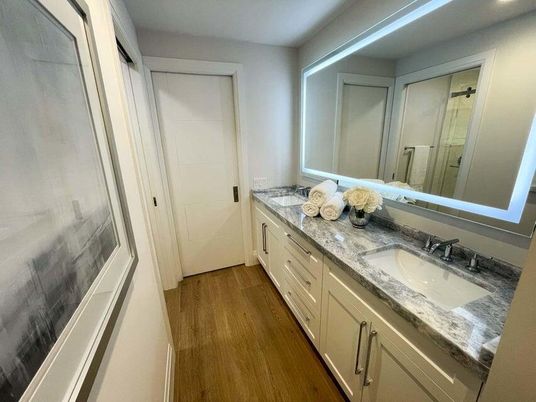 Bathroom, Dual Sink Vanities, Interior, Recessed Lighting, Wood Texture Flooring