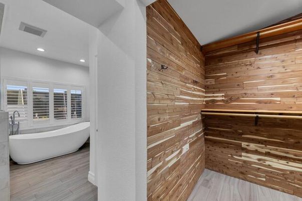 Bathroom, Free Standing Baths, Interior, Recessed Lighting, Wood Texture Flooring, Wooden Walls