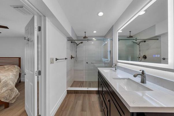 Bathroom, Dual Sink Vanities, Glass Shower, Interior, Recessed Lighting, Wood Texture Flooring