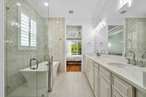 Bathroom, Dual Sink Vanities, Glass Shower, Interior, Marble, Recessed Lighting, Wood Texture Flooring