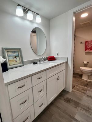 Bathroom, Dual Sink Vanities, Interior, Recessed Lighting, Wood Texture Flooring