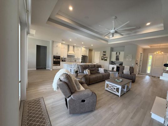 Chandelier, Interior, Kitchen, Living room, Pendant Lights, Recessed Lighting, Stainless Steel Appliances, Wood Texture Flooring