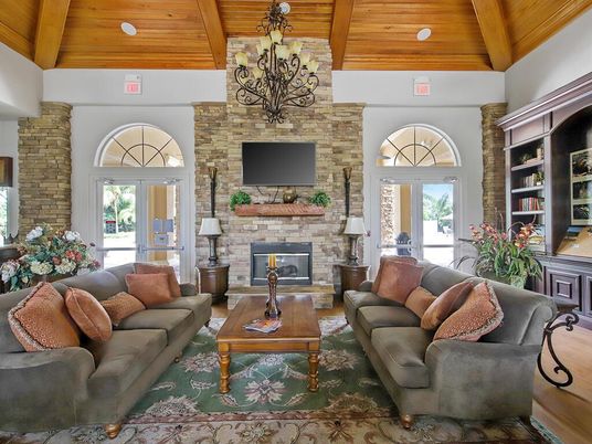 Chandelier, Fireplace, Interior, Living room, Recessed Lighting, Stone Walls, Wooden Beams, Wooden Ceilings