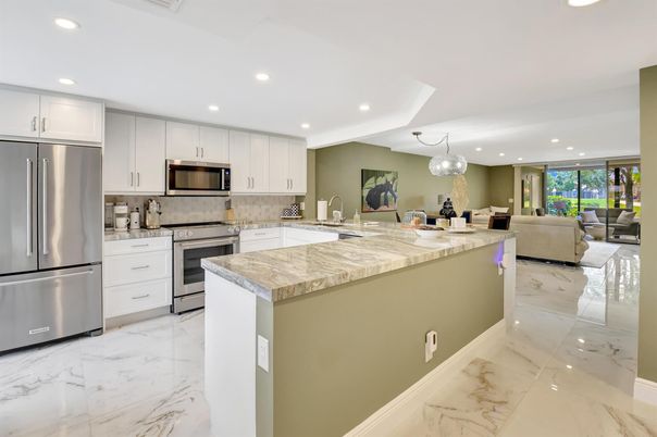 Chandelier, Interior, Kitchen, Living room, Marble, Pendant Lights, Recessed Lighting, Stainless Steel Appliances