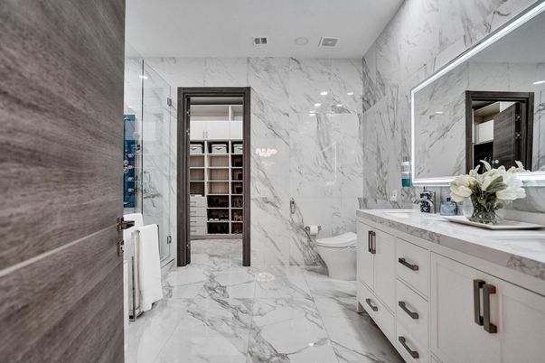 Bathroom, Dual Sink Vanities, Interior, Marble, Marble Walls, Recessed Lighting, Walk-in Closets