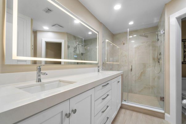 Bathroom, Dual Sink Vanities, Glass Shower, Interior, Recessed Lighting, Wood Texture Flooring
